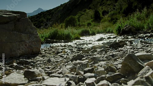 A river flowing through a naturale rocky enviorment.