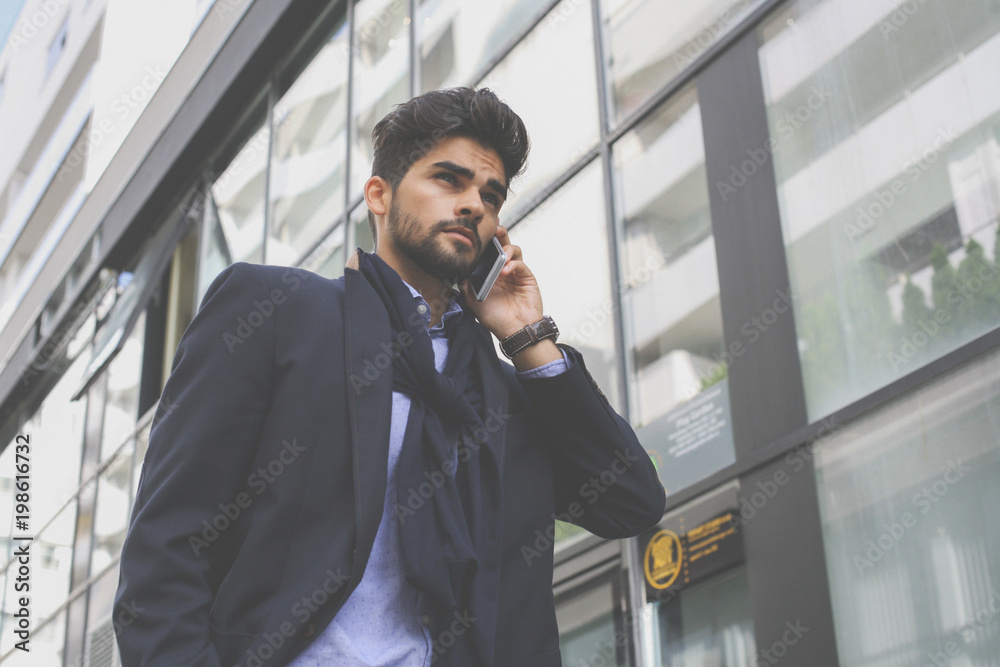 Worried businessman on street talking on mobile phone. Worried businessman on street talking on mobile phone.