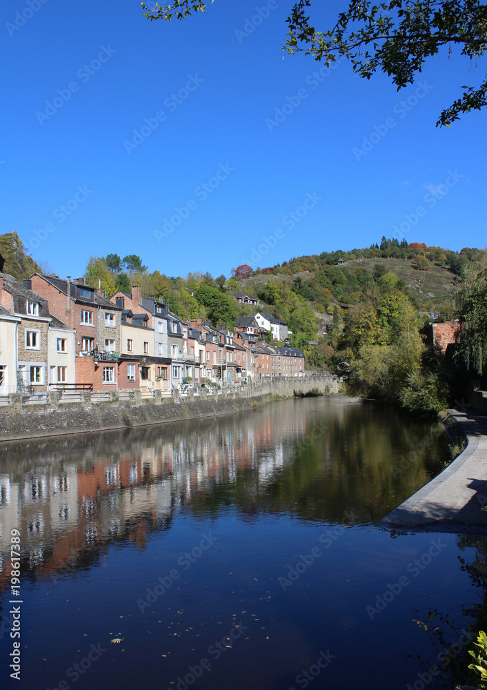View of the beautiful River Ourthe as it runs through the picturesque town of La Roche en Ardenne in Wallonia, Belgium. With copy space.