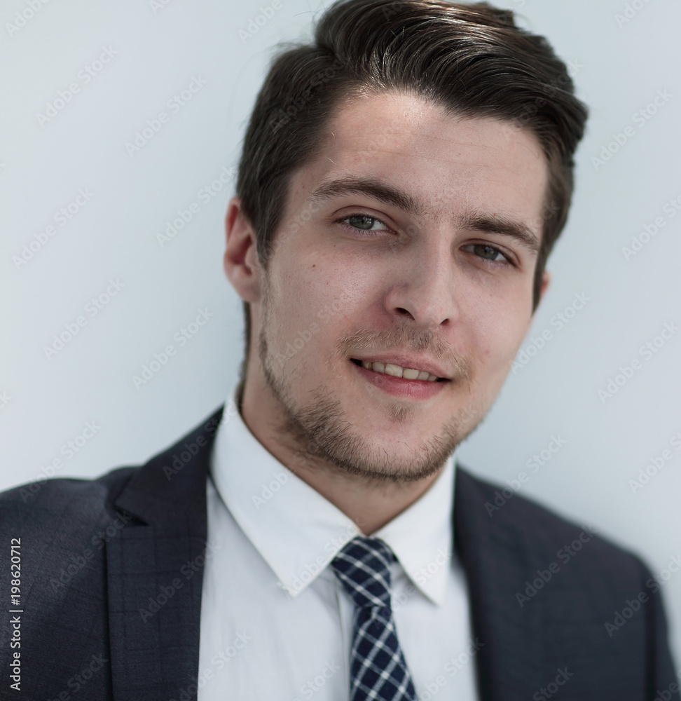 closeup.the face of a successful young man closeup.the face of a successful young man