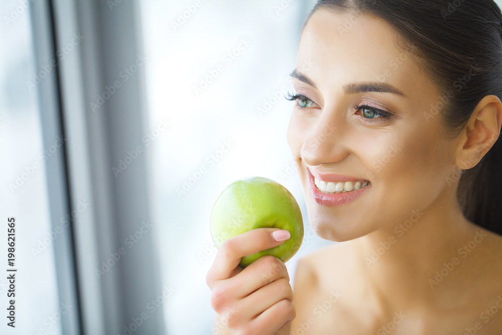 Woman With Apple. Beautiful Girl With White Smile, Healthy Teeth. High Resolution Image Woman With Apple. Beautiful Girl With White Smile, Healthy Teeth. High Resolution Image