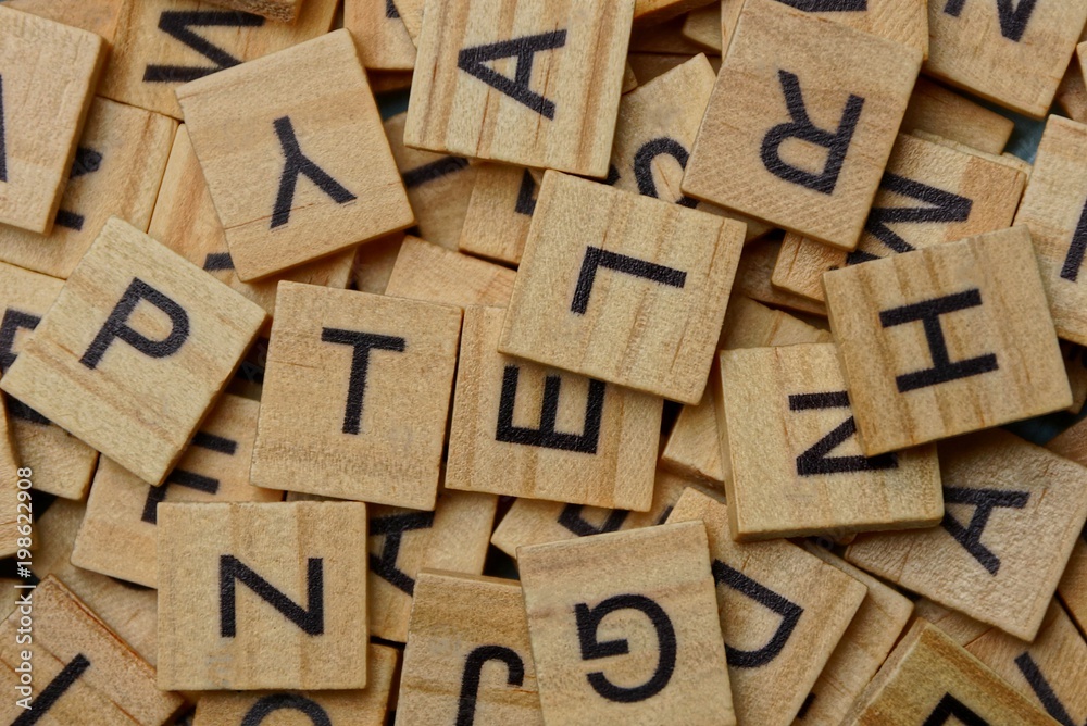 texture of small wooden letters in a heap