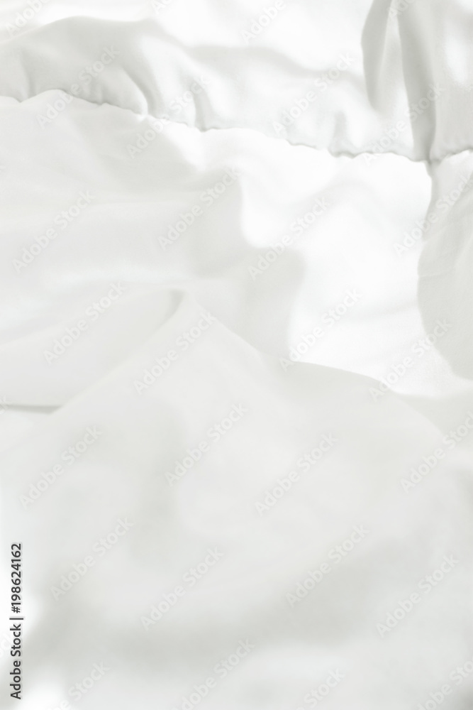 White Cotton Blanket in Bedroom with Bright Morning Sunlight Streaming through Window. Highlights Leaks. Blank Template for Poster Banner. Energy Waking up Relaxation Purity Concept. Copy Space