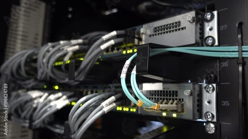 Data center flashing lights. back side of working data servers. router working. Big data center lights. has a small noise