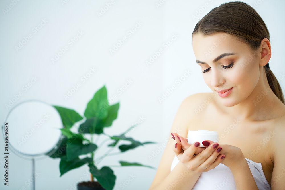 Beauty Skin Care. Beautiful Woman Applying Cosmetic Face Cream Beauty Skin Care. Beautiful Woman Applying Cosmetic Face Cream