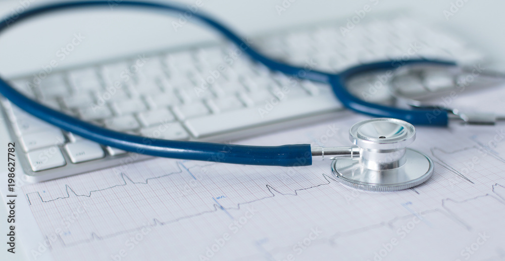 Doctor's workspace working table with patient's discharge blank paper form, medical prescription, stethoscope on desk Doctor's workspace working table with patient's discharge blank paper form, medical prescription, stethoscope on desk