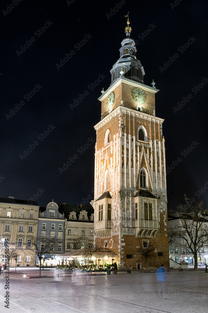 Town hall tower at night in Krakow, Poland