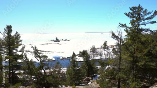 Georgian Bay Thirthy Thousand Islands panning view from Chikanishing Trail in Killarney Provincial Park of Ontario in winter photo