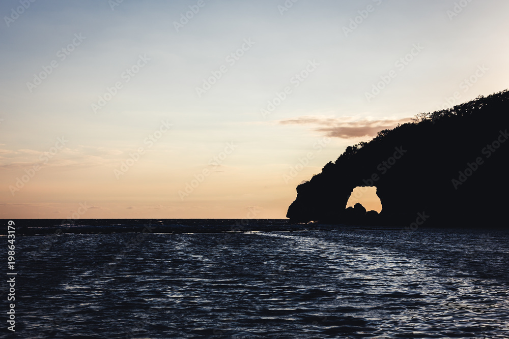 Natural arch with a sunrise