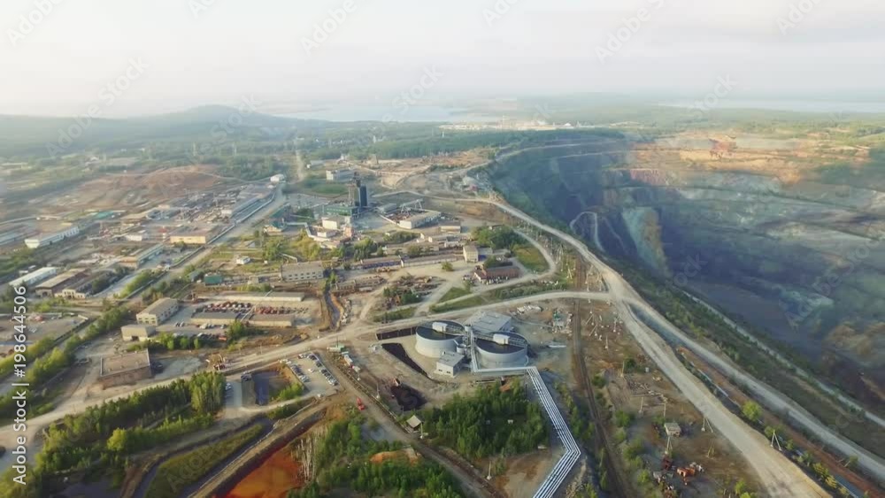 Aerial view industrial of opencast mining quarry with lots of machinery at work - view from above. Extraction of gold, copper Aerial view industrial of opencast mining quarry with lots of machinery at work - view from above. Extraction of gold, copper