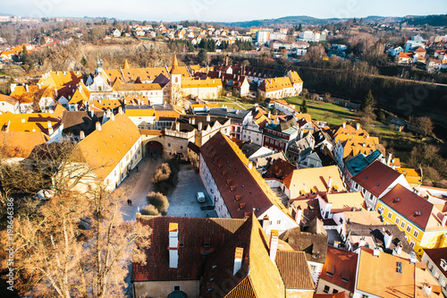 Fototapeta Naklejka Na Ścianę i Meble -  A view from the air to beautiful authentic houses and streets in the town of Cesky Krumlov in the Czech Republic. One of the most beautiful small towns in the world. Europe.