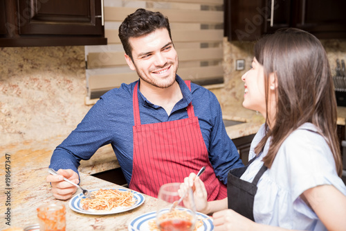 Couple having lunch together in kitchen