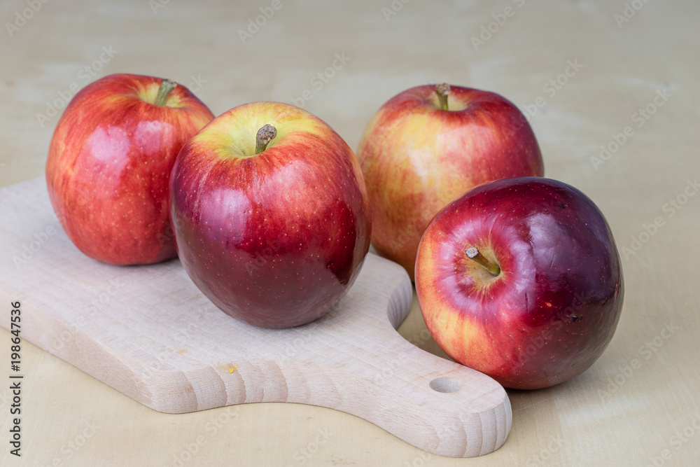 Tasty and ripe apples. Fruit sprinkled with water on a wooden kitchen table. Tasty and ripe apples. Fruit sprinkled with water on a wooden kitchen table.