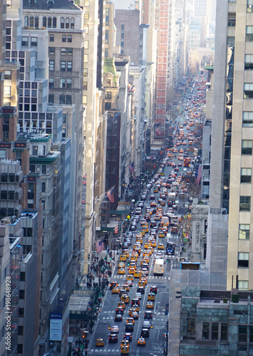Wallpaper Mural Looking down into 5th Avenue with cars in traffic in Manhattan, New York City. Torontodigital.ca