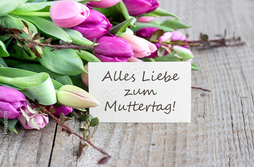 greeting card for Mother's Day / Greeting card to Mother's Day with pink and violet tulips, heart and german text: Happy Mother's Day