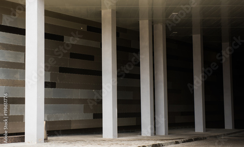 Cement pillars, surround a dark grey background