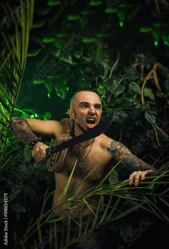 a man in the jungle with machetes attacking the enemy