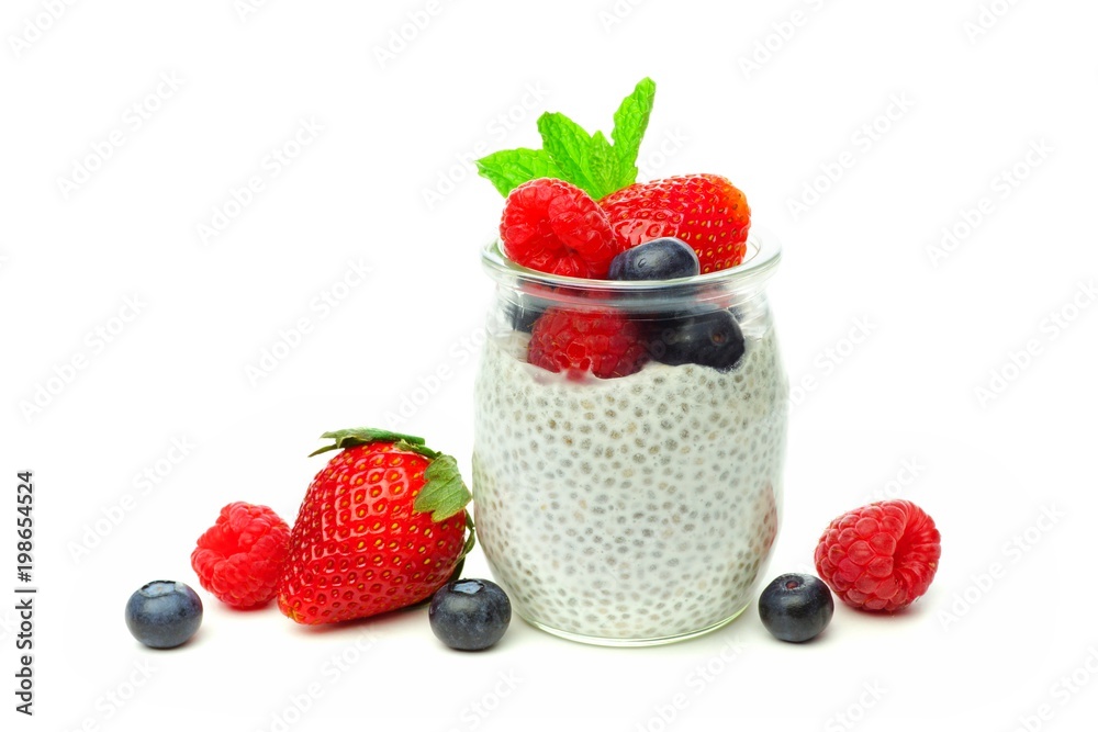 Healthy berry chia pudding in a jar with scattered fruit isolated on a white background Healthy berry chia pudding in a jar with scattered fruit isolated on a white background