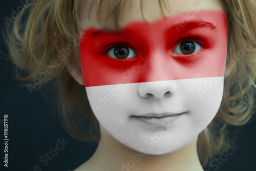 Fototapeta Naklejka Na Ścianę i Meble -  Child with a painted flag of Indonesia