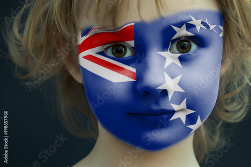 Child with a painted flag of Cook Islands