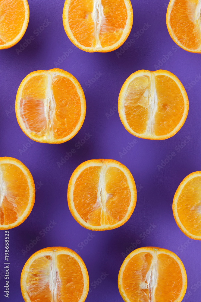 Sliced fruit oranges in checkered pattern on a purple background, symmetrically laid out citrus in pop art style, fruit pattern of halves of oranges, ultraviolet, minimalism, art Sliced fruit oranges in checkered pattern on a purple background, symmetrically laid out citrus in pop art style, fruit pattern of halves of oranges, ultraviolet, minimalism, art