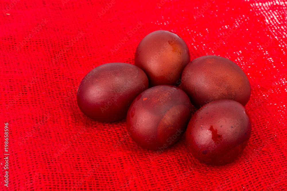 Red painted eggs as symbol of the holiday of Easter