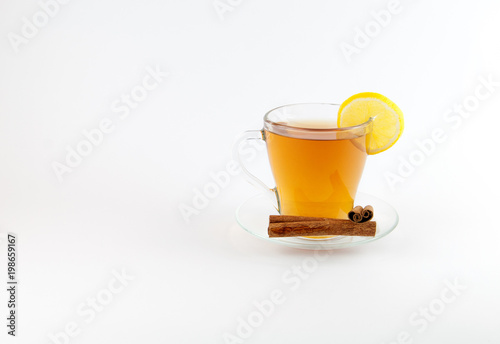 Tea cup with lemon and cinnamon isolated on white background.