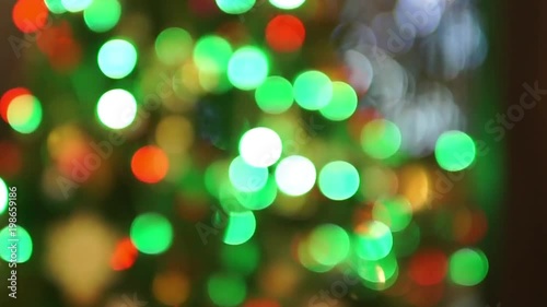 Abstract blurred christmas Lights bokeh of Christmas Tree Lights Blinking and Twinkling. Christmas and new year holiday concept.