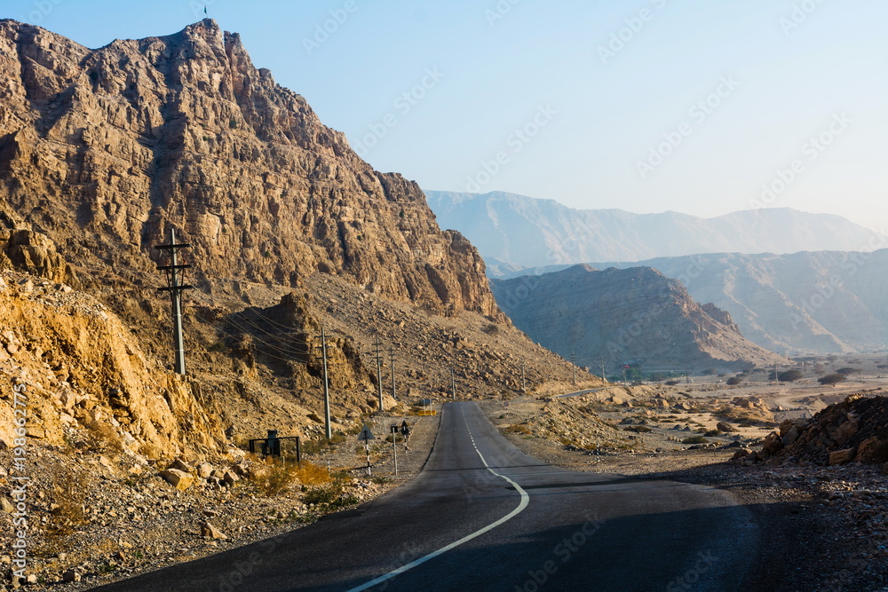 Road through dessert mountain Jabal Jais in UAE