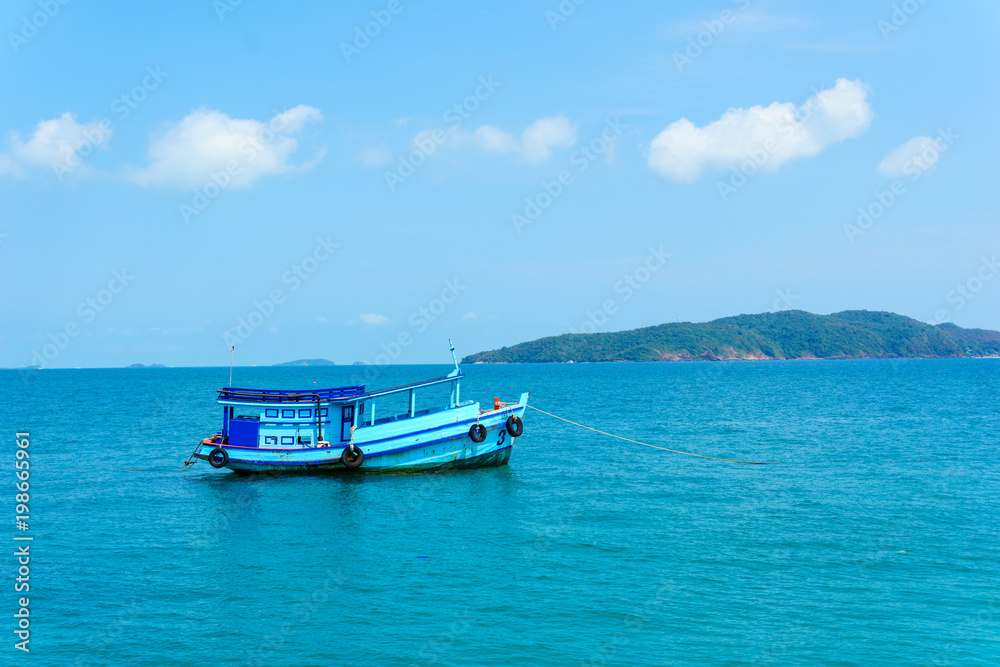Fototapeta premium landscape view of seascape and skyline in the ocean with fishing boat and island.