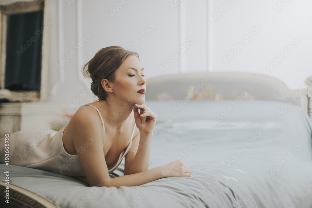 Beautiful classy woman in her bedroom Beautiful classy woman in her bedroom