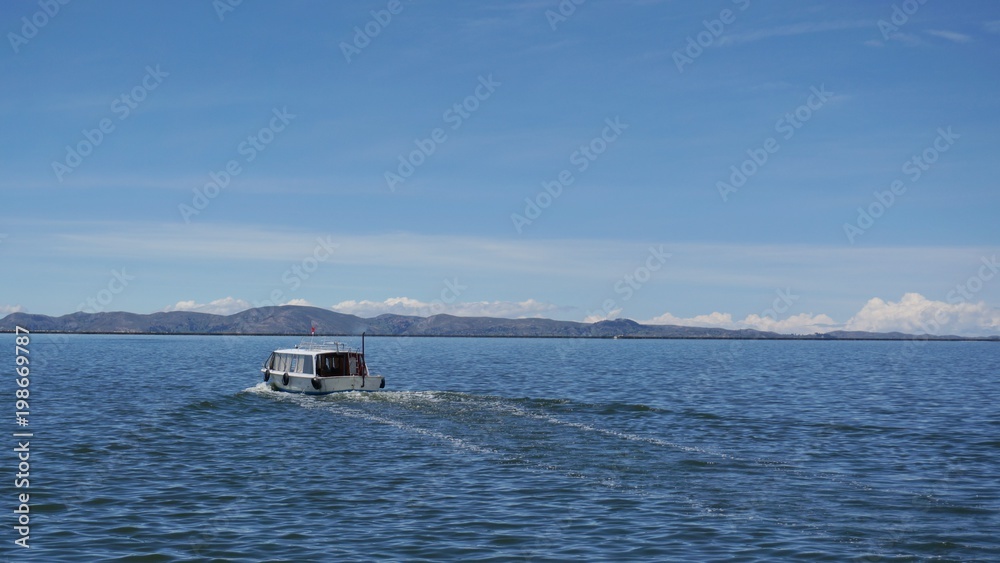 A boat sailing over lake Titicaca
