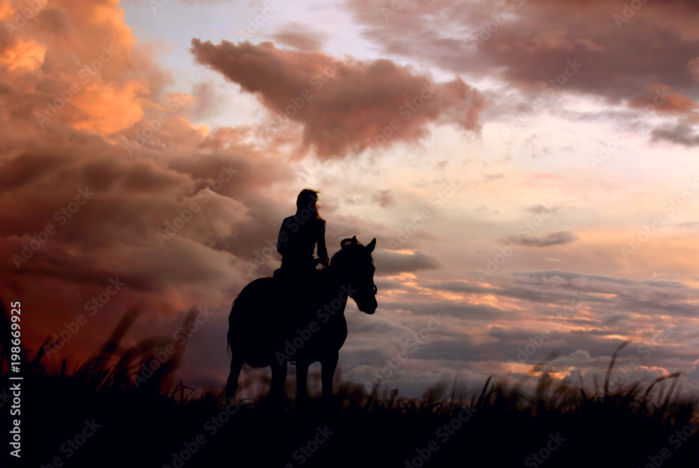 Thunder: atmospheric background of equine and girls silhouette on colorful storm clouds before a thunder-storm. Scene of horseback, riding horse on peak in moment of weather change.