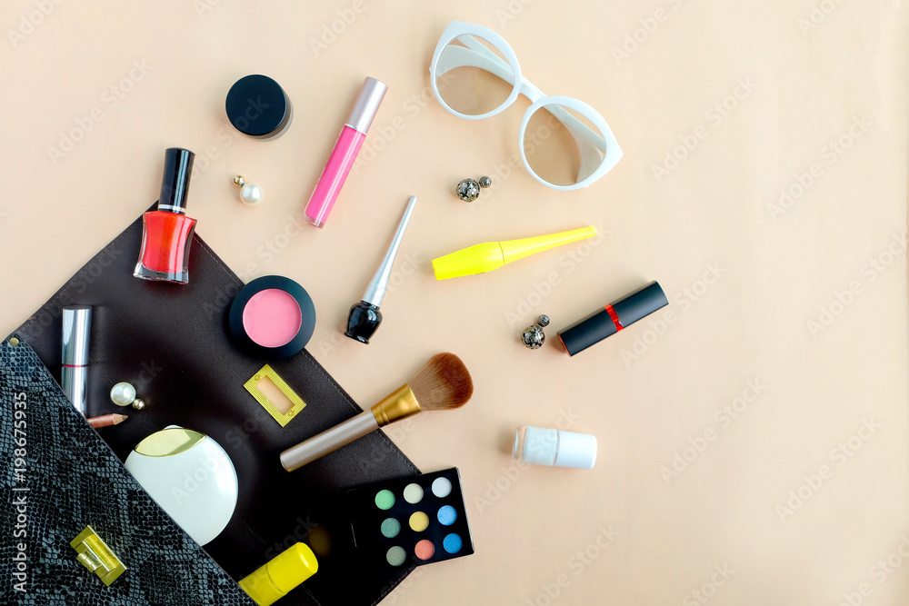 bag fashion professional makeup accessories equipment attractive fashion woman .on colorful background