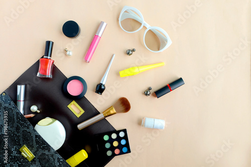 bag fashion professional makeup accessories equipment attractive fashion woman .on colorful background