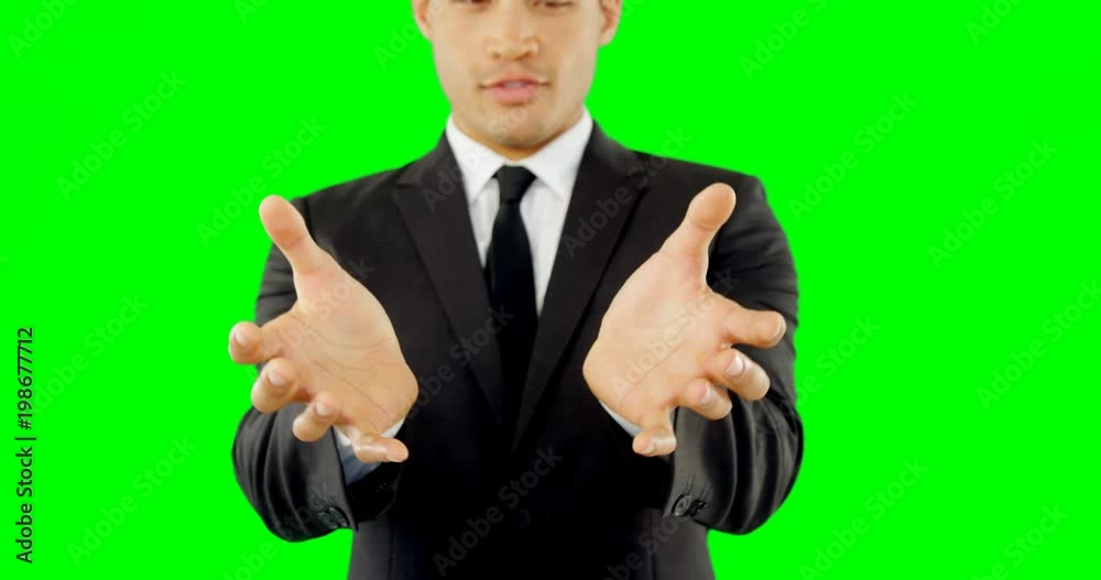 Businessman pretending to hold an invisible object Businessman pretending to hold an invisible object