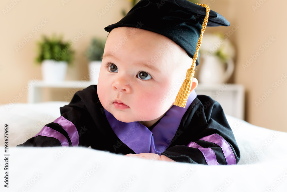 Little Asian Girl In Graduation Cap And Gown With Bokeh Background Free  Image and Photograph 198652411.
