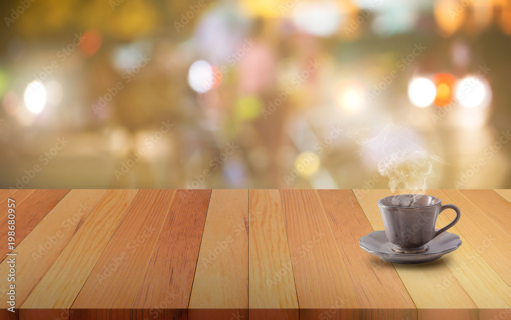 Ceramic coffee mug on a wooden board or table and abstract blurred background Ceramic coffee mug on a wooden board or table and abstract blurred background