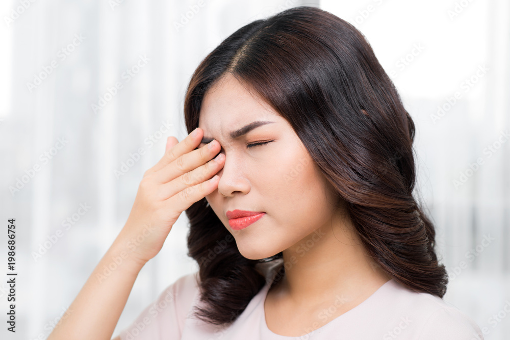 Pain. Tired Exhausted Stressed Woman Suffering From Strong Eye Pain. Portrait Of Beautiful Young Female Feeling Sick, Having Headache, Nose Pain And Touching Painful Eyes. Healthcare. High Resolution Pain. Tired Exhausted Stressed Woman Suffering From Strong Eye Pain. Portrait Of Beautiful Young Female Feeling Sick, Having Headache, Nose Pain And Touching Painful Eyes. Healthcare. High Resolution