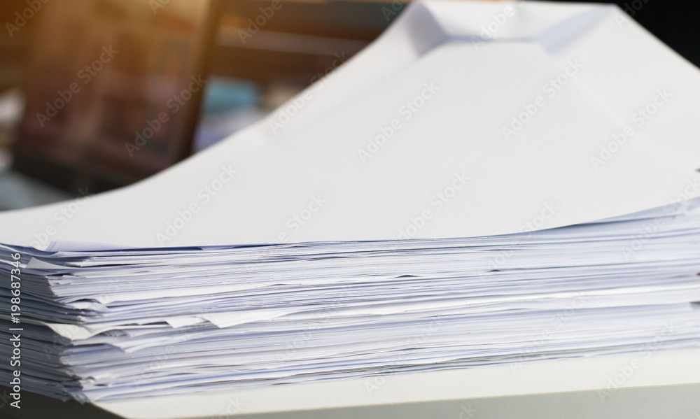 Stack white paper Document pile on office desk, Stack of business paper on  table with blurred of meeting room background. Job busy business concepts.  Stock Photo | Adobe Stock