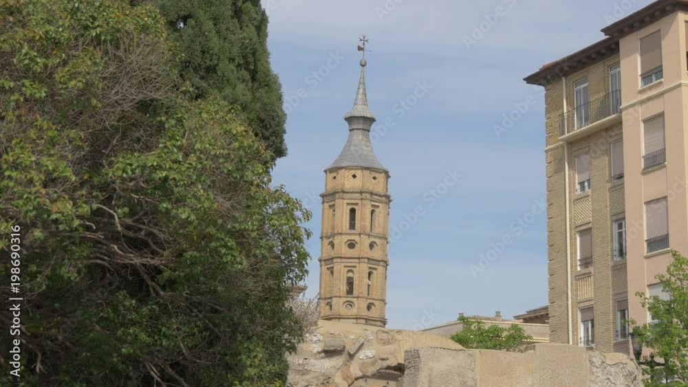 Church tower seen behind the Roman walls Church tower seen behind the Roman walls