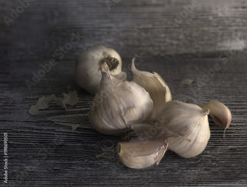 Still life of garlic on an old blackboard. Garlic crop.