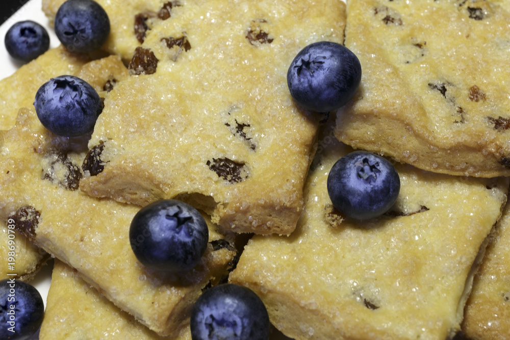 Shortbread cookies with blueberries as the concept of Breakfast. Tasty background.