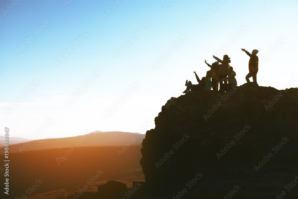 Group of happy people on mountain top