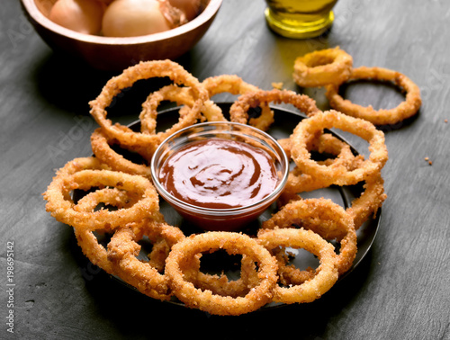 Fried onion rings and ketchup