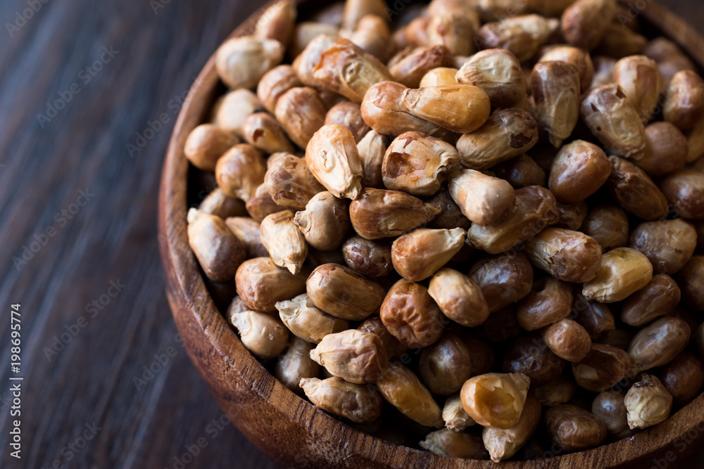 Turkish Snacks Kavurga / Fried Corn Seeds in Wooden Bowl. Turkish Snacks Kavurga / Fried Corn Seeds in Wooden Bowl.