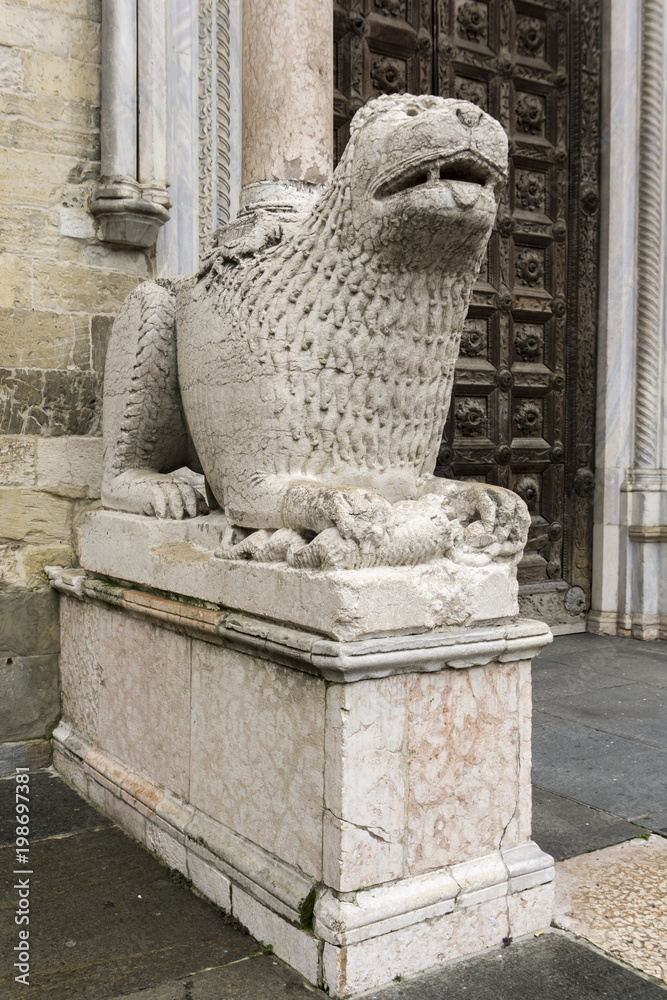Lion statue in front of Parma Cathedral, Italy