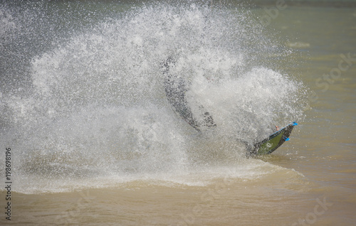 Kitesurfer in action on tropical sea