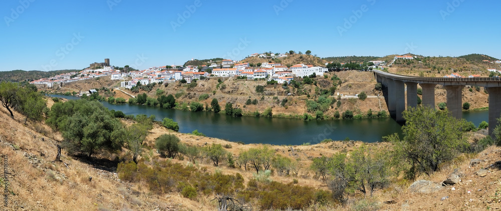 The panoramic view of Mertola town and the bridge over the Guadiana river. Portugal
