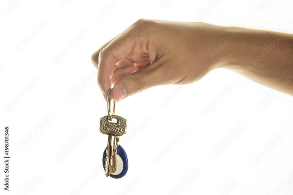 Hand holding a key. Key apartment deal purchase concept on white isolated background. Hand holding a key. Key apartment deal purchase concept on white isolated background.